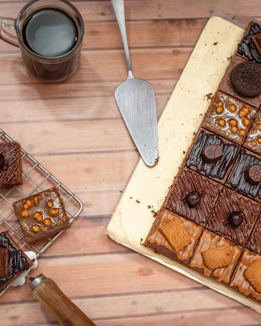 Large board of assorted brownies, cookies and bakes laid out as a spread